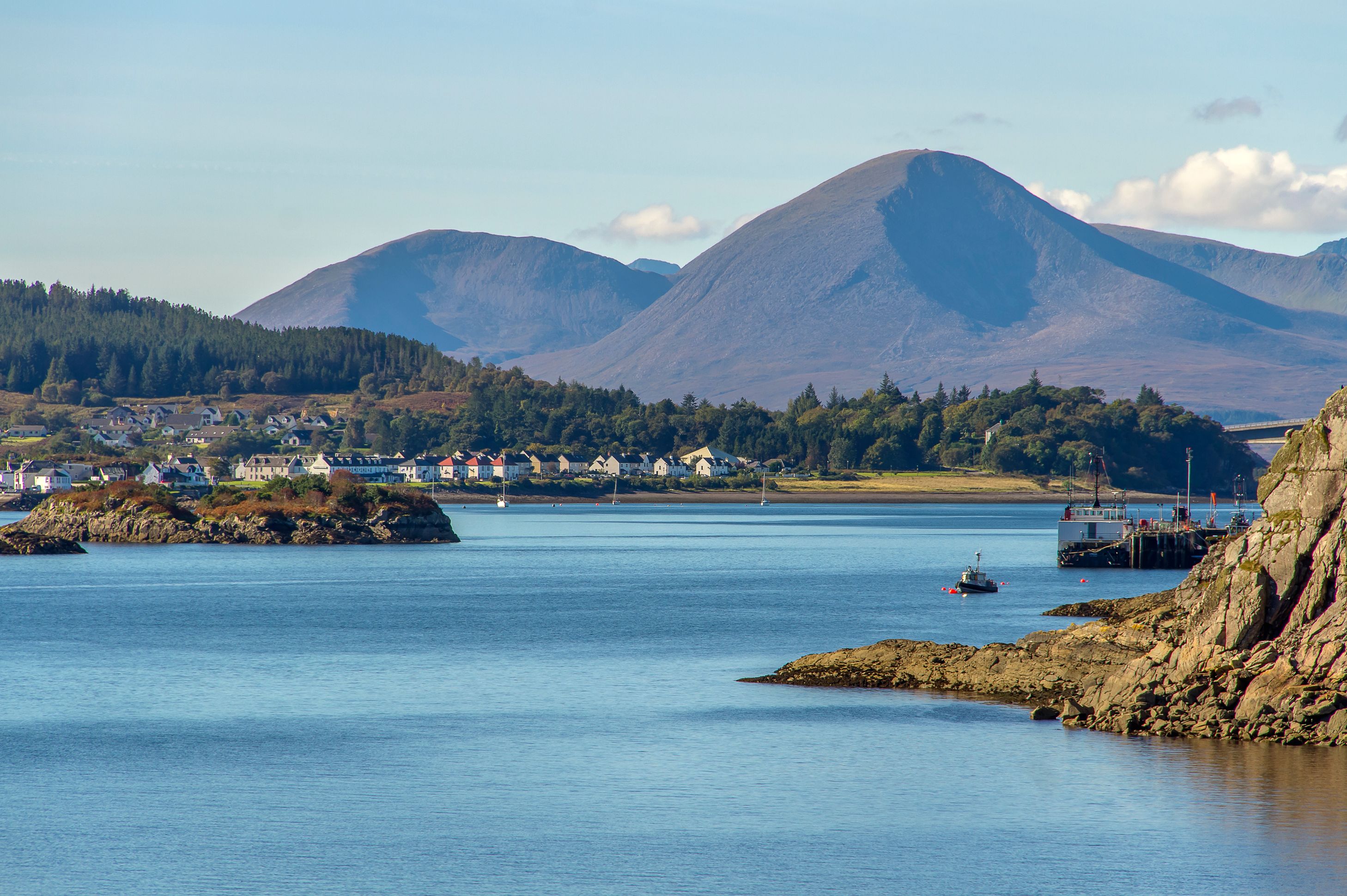 View of the Kyle of Lochalsh with Scottish Highland mountains behind it 
