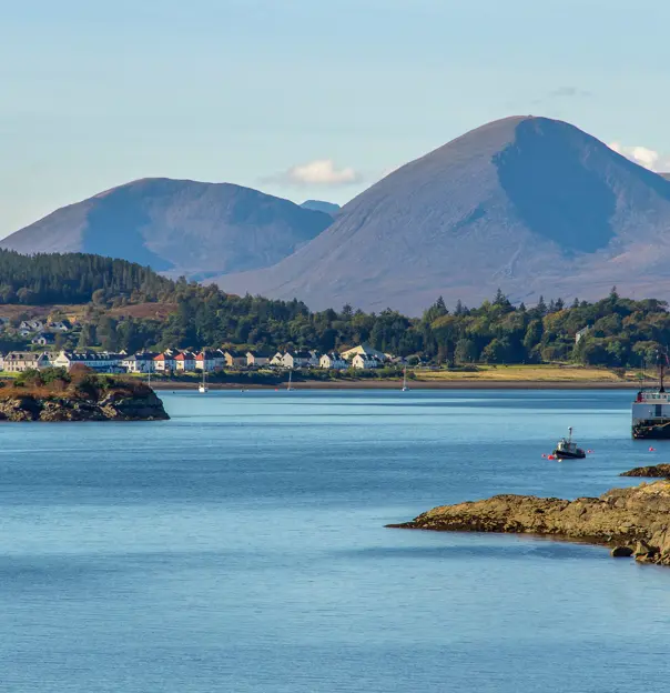 View of the Kyle of Lochalsh with Scottish Highland mountains behind it 