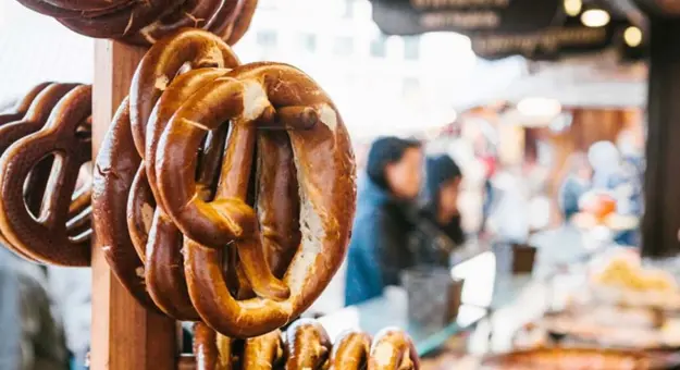 Traditional pretzels, called brezel, hanging on a market stall, Berlin